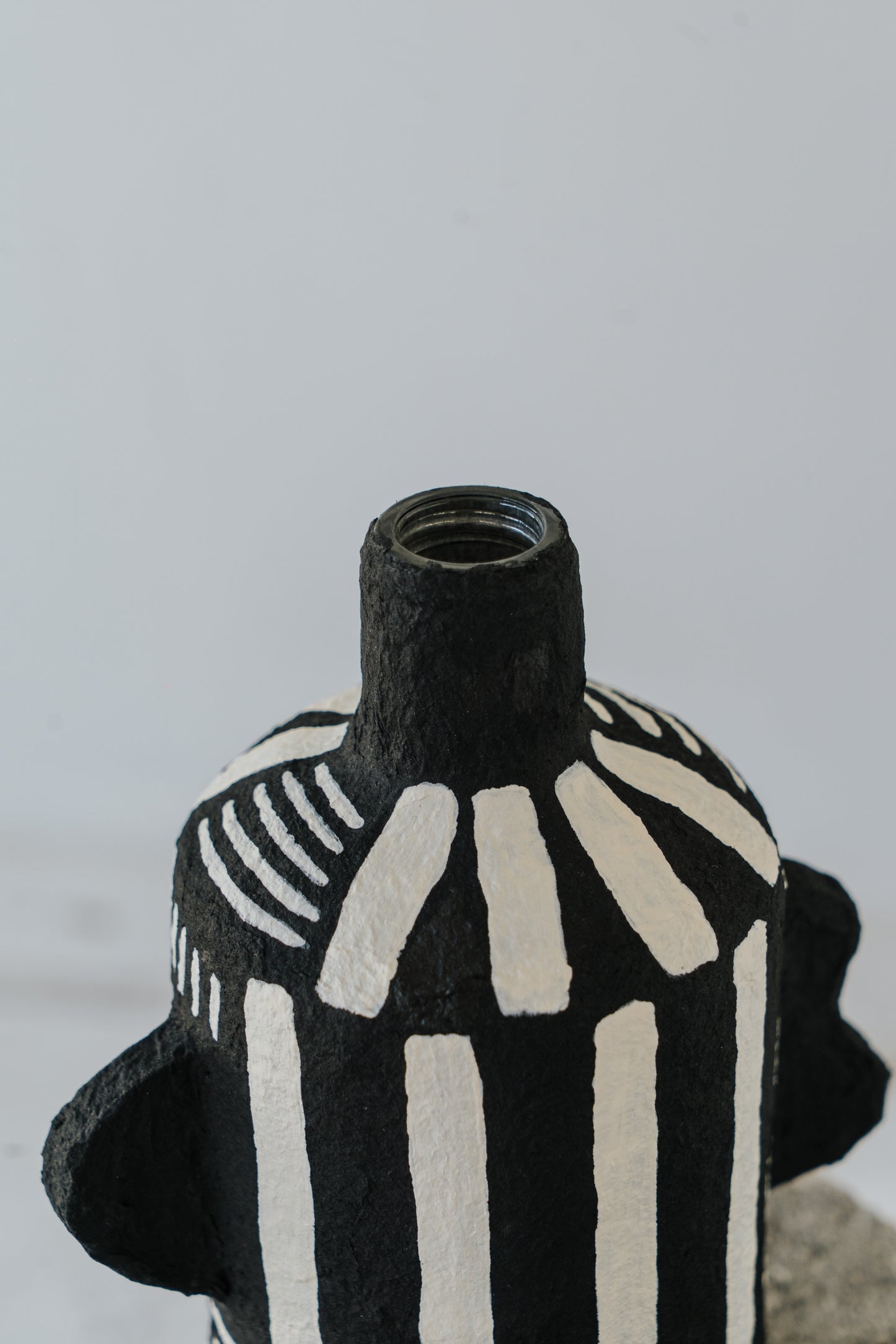 Black Vase with White Stripes